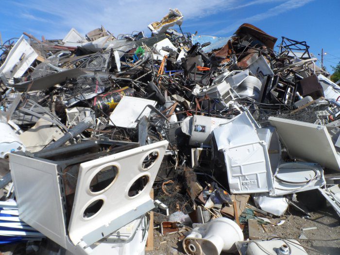 the impact of waste: Used products dumped at a scrap metal recycler